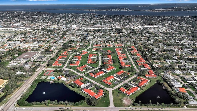 drone / aerial view with a residential view and a water view