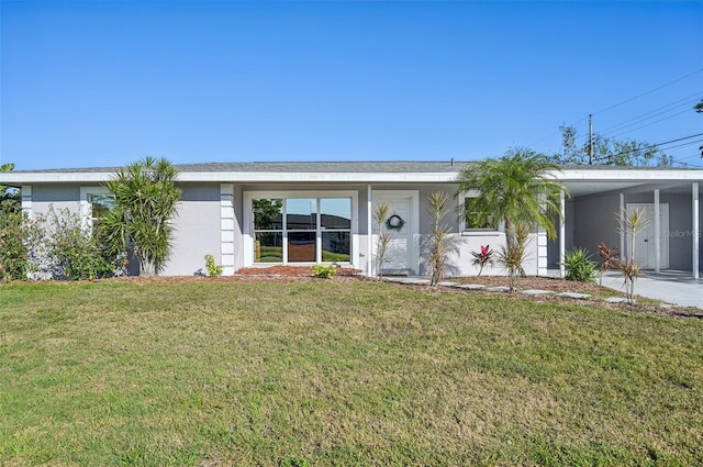 ranch-style house with a carport and a front yard