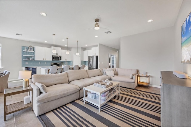 5333 Charlie Brown Ln, Sarasota, FL 34233 - living room featuring recessed lighting, a ceiling fan, beverage cooler, and baseboards