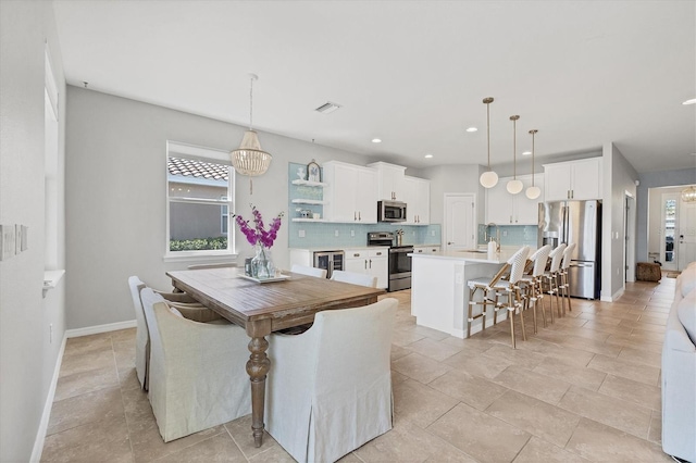 5333 Charlie Brown Ln, Sarasota, FL 34233 - dining area with baseboards and recessed lighting