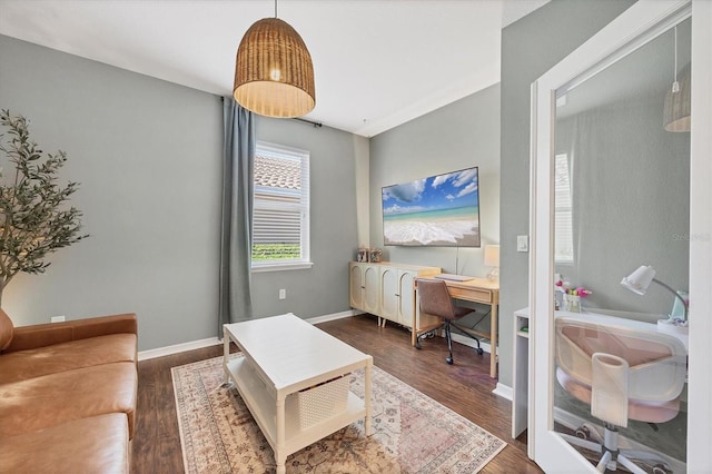 5333 Charlie Brown Ln, Sarasota, FL 34233 - home office with dark wood-style flooring and baseboards
