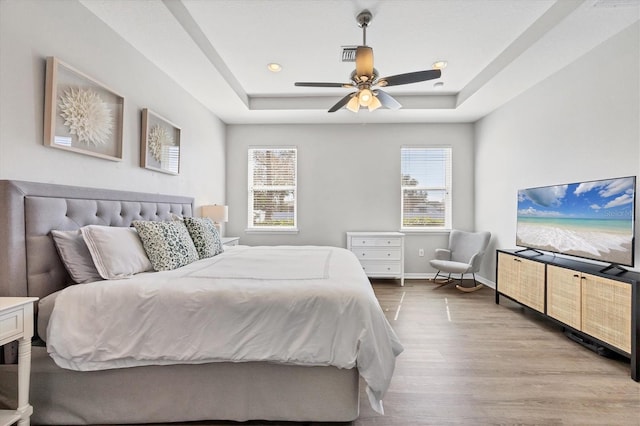 5333 Charlie Brown Ln, Sarasota, FL 34233 - bedroom featuring a raised ceiling, wood finished floors, a ceiling fan, baseboards, and recessed lighting