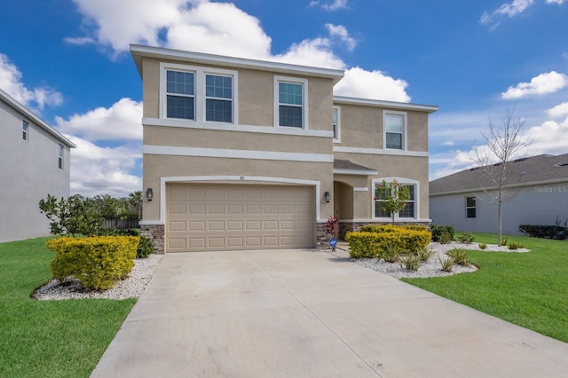 view of front of home featuring driveway, stone siding, a front lawn, and stucco siding