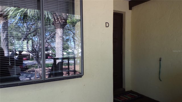 view of exterior entry featuring stucco siding