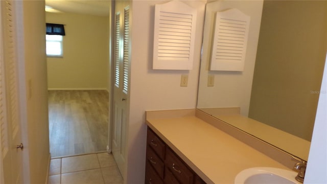 bathroom with tile patterned floors and vanity