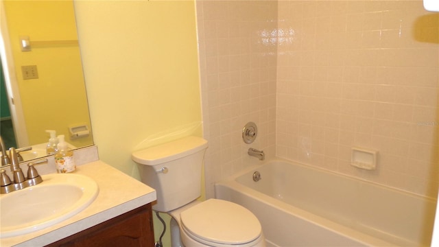 bathroom with toilet, vanity, and shower / tub combination