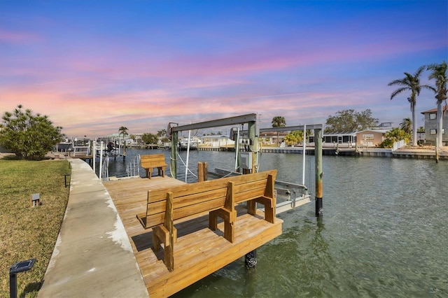 dock area with a water view and boat lift