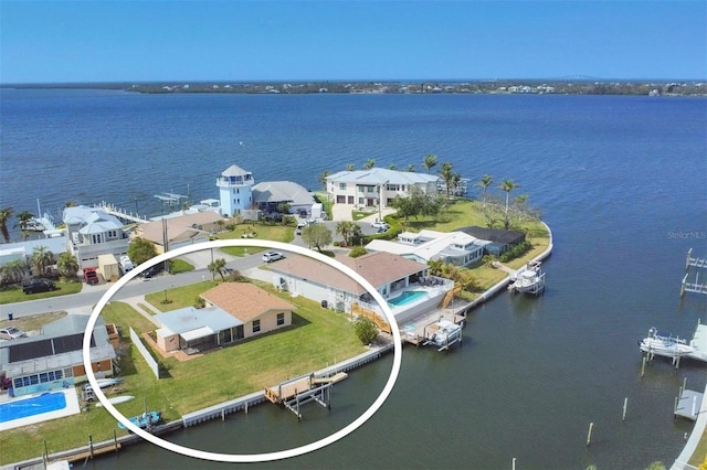 bird's eye view with a water view and a residential view