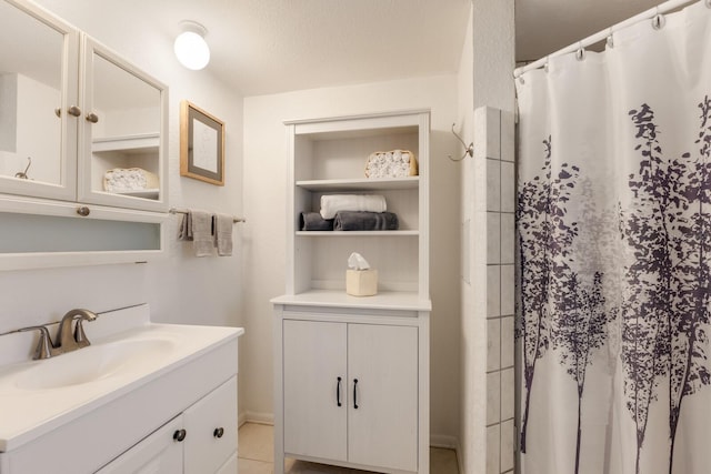 bathroom featuring built in shelves, tile patterned flooring, vanity, and a shower with shower curtain