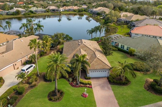 bird's eye view featuring a water view and a residential view