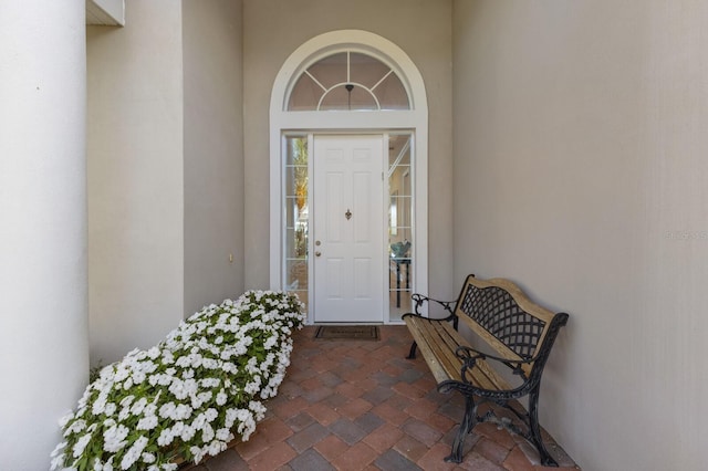 property entrance featuring stucco siding