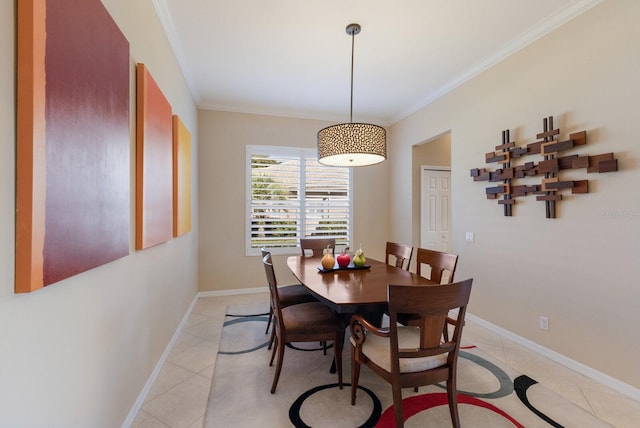 dining area with crown molding, baseboards, and light tile patterned floors