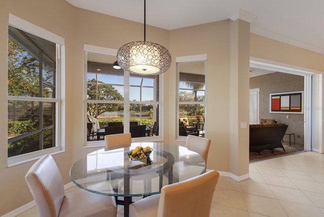 dining room featuring light tile patterned flooring and baseboards