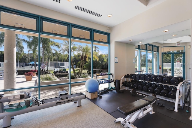 exercise room featuring a healthy amount of sunlight and visible vents