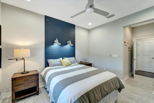 bedroom with baseboards, recessed lighting, visible vents, and light wood-style floors