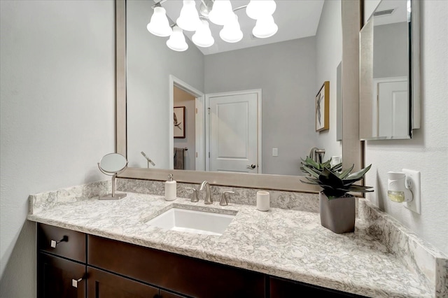 bathroom featuring visible vents and vanity