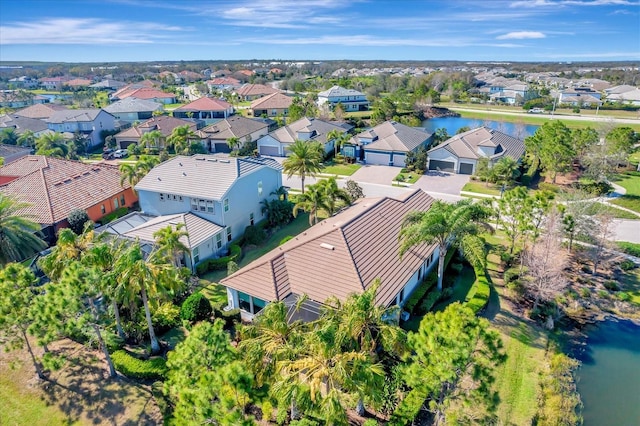 bird's eye view with a residential view and a water view