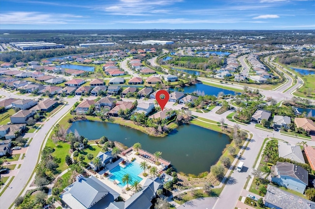 birds eye view of property featuring a water view and a residential view