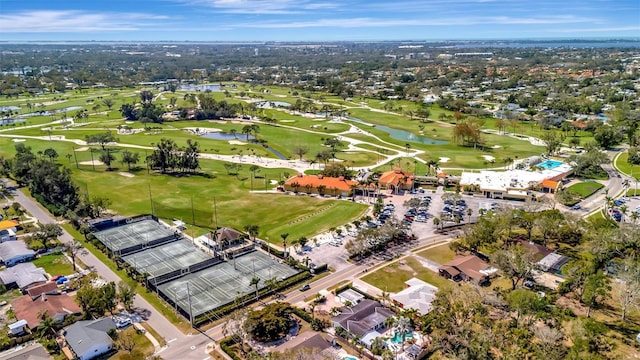 birds eye view of property featuring a water view and golf course view