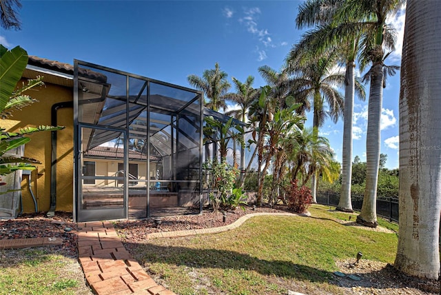 view of yard with a lanai