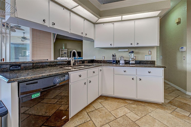 kitchen featuring stone tile flooring, a sink, white cabinets, and dishwasher