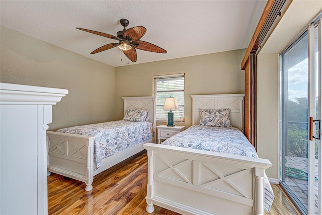 bedroom featuring dark wood-style floors and ceiling fan