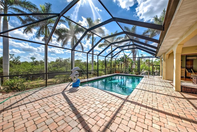 outdoor pool featuring a lanai and a patio