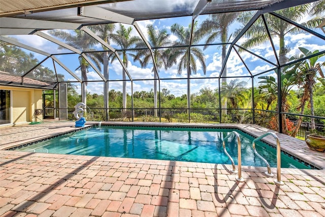 pool with a lanai and a patio