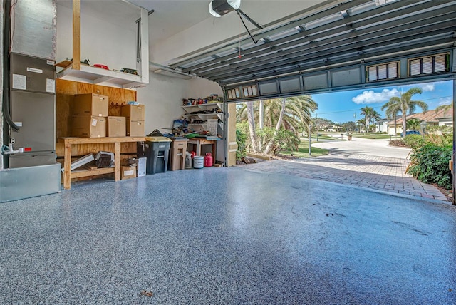 garage with a garage door opener and heating unit