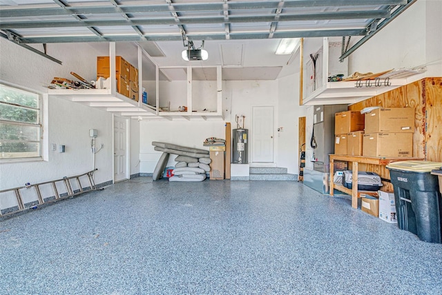 garage featuring electric water heater and a garage door opener