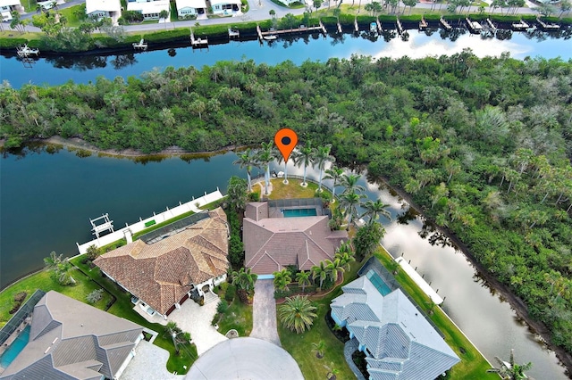 birds eye view of property with a water view