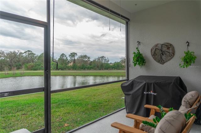 sunroom with a water view