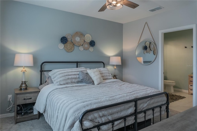 bedroom featuring baseboards, visible vents, ensuite bath, ceiling fan, and carpet floors