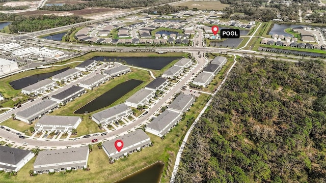 aerial view featuring a water view and a residential view