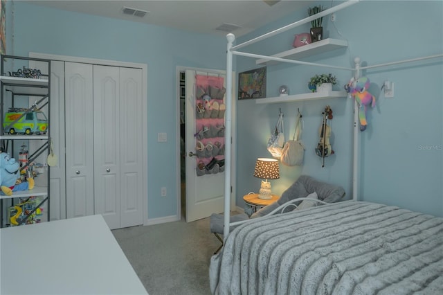 carpeted bedroom with visible vents and a closet