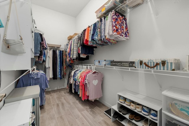 spacious closet featuring wood tiled floor