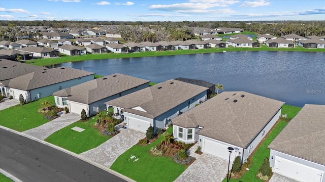 birds eye view of property featuring a residential view and a water view