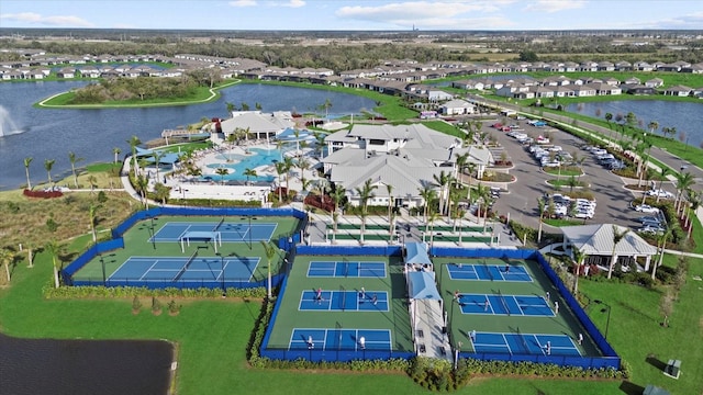 birds eye view of property with a water view and a residential view