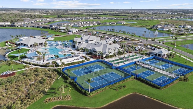 birds eye view of property featuring a residential view and a water view