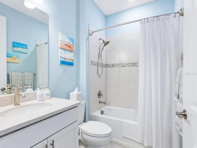 bathroom with toilet, shower / bath combo, and vanity