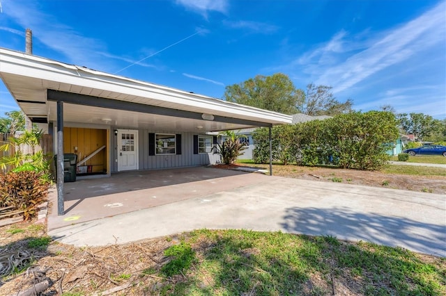 view of front of property with a carport and board and batten siding