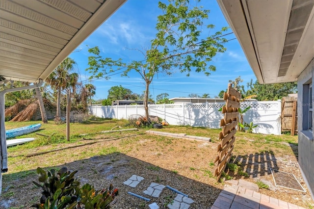 view of yard with a fenced backyard