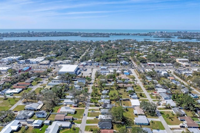 drone / aerial view with a water view and a residential view