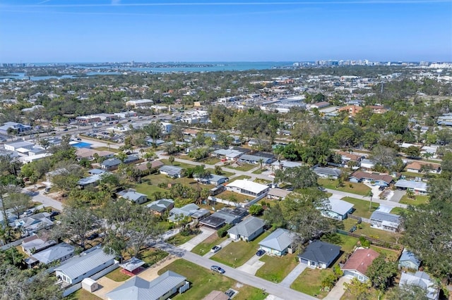 birds eye view of property with a water view and a residential view