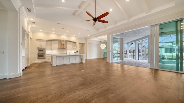 unfurnished living room featuring high vaulted ceiling, a ceiling fan, baseboards, beam ceiling, and dark wood finished floors