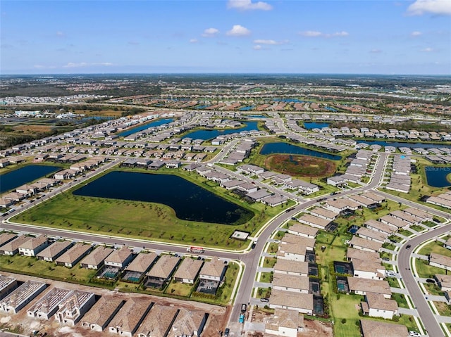 birds eye view of property with a residential view and a water view