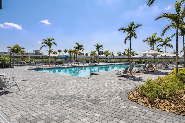 pool featuring a patio area and fence