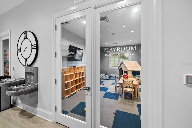 interior space with visible vents, baseboards, and recessed lighting