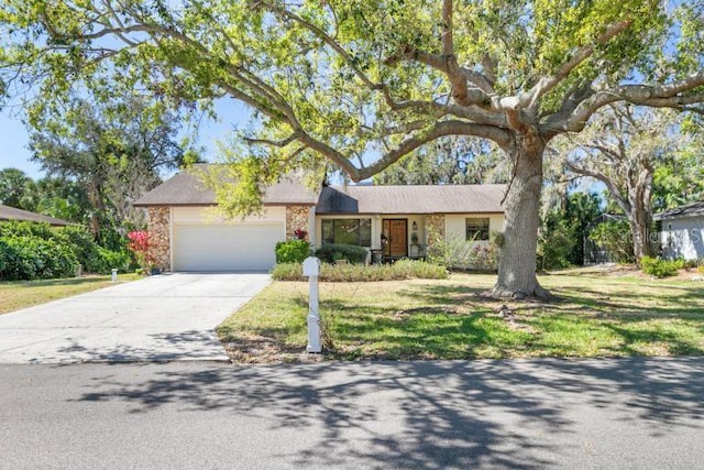 ranch-style home with a front lawn and a garage