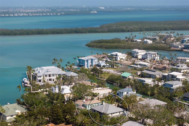 drone / aerial view with a residential view and a water view